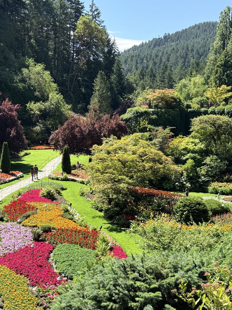 Colourful flower gardens and landscaped paths at The Butchart Gardens near Victoria, British Columbia.