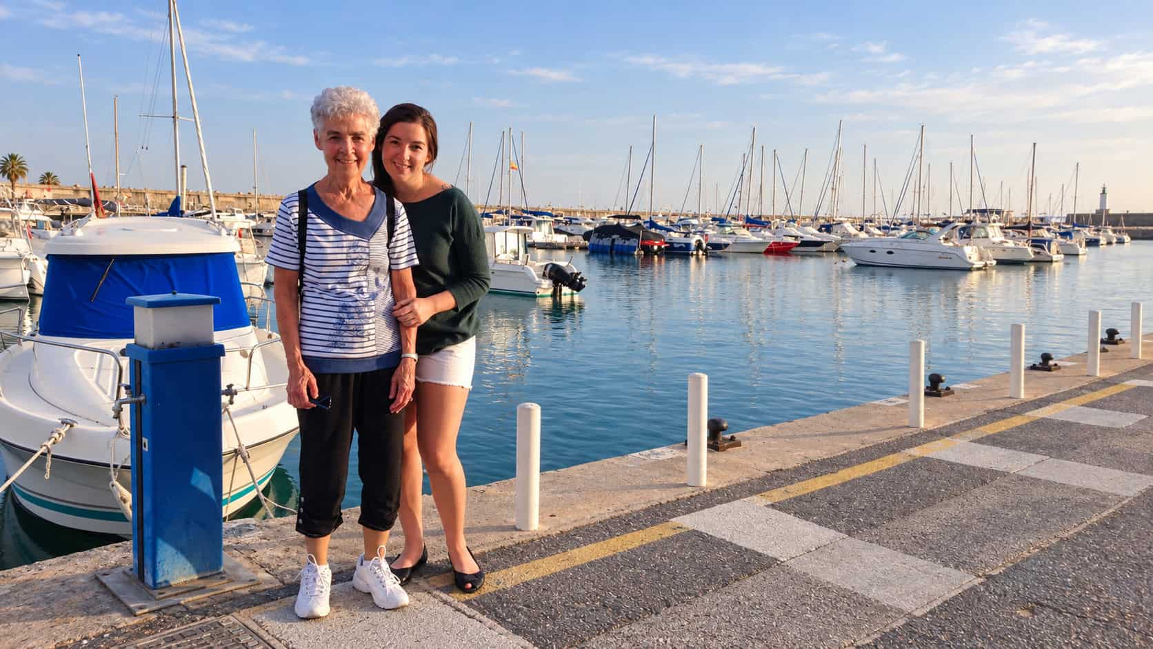 Annie walking along the Costa del Sol seaside promenade in Spain with her grandmother