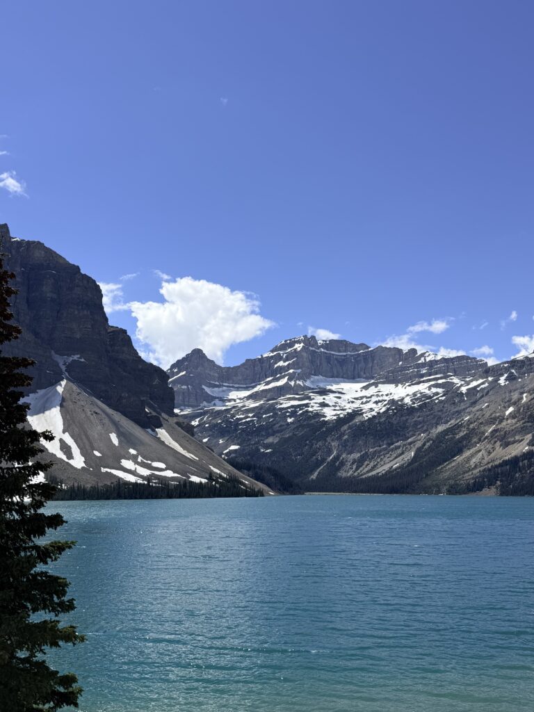 Scenic view across Bow Lake toward snow-covered Rocky Mountain peaks in Banff National Park.