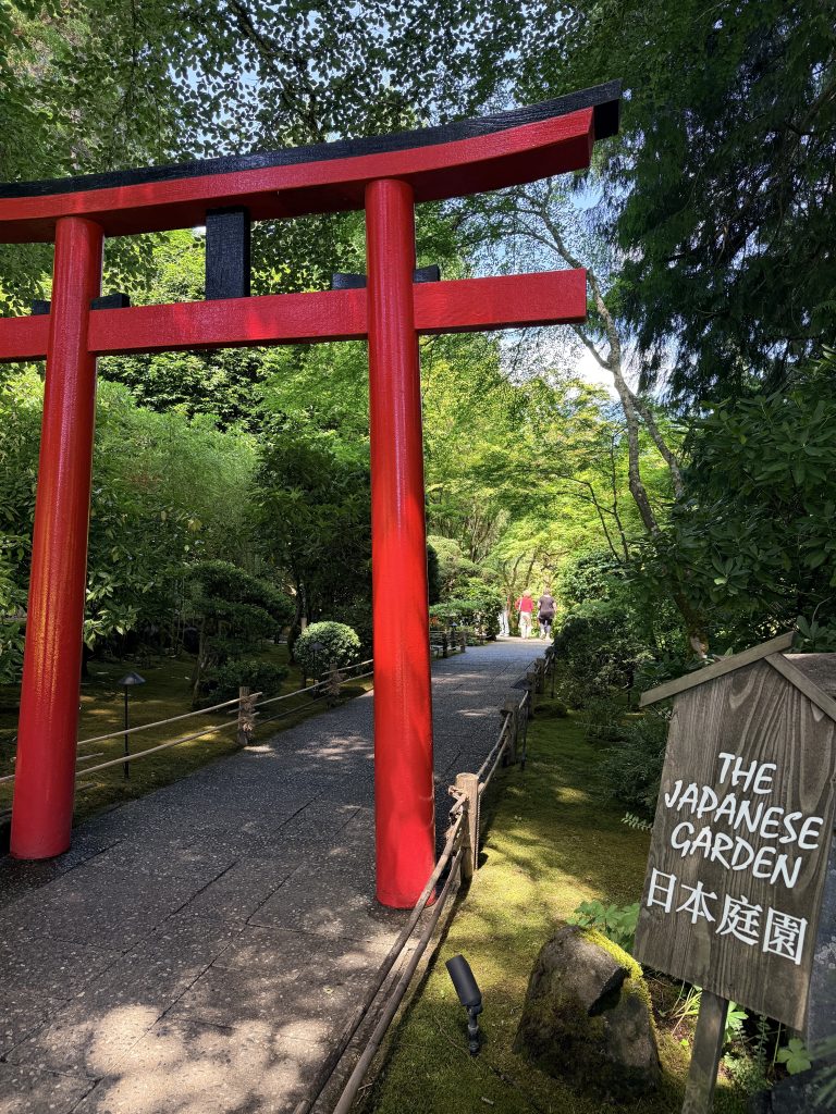 Red torii gate marking the entrance to the Japanese Garden at The Butchart Gardens.
