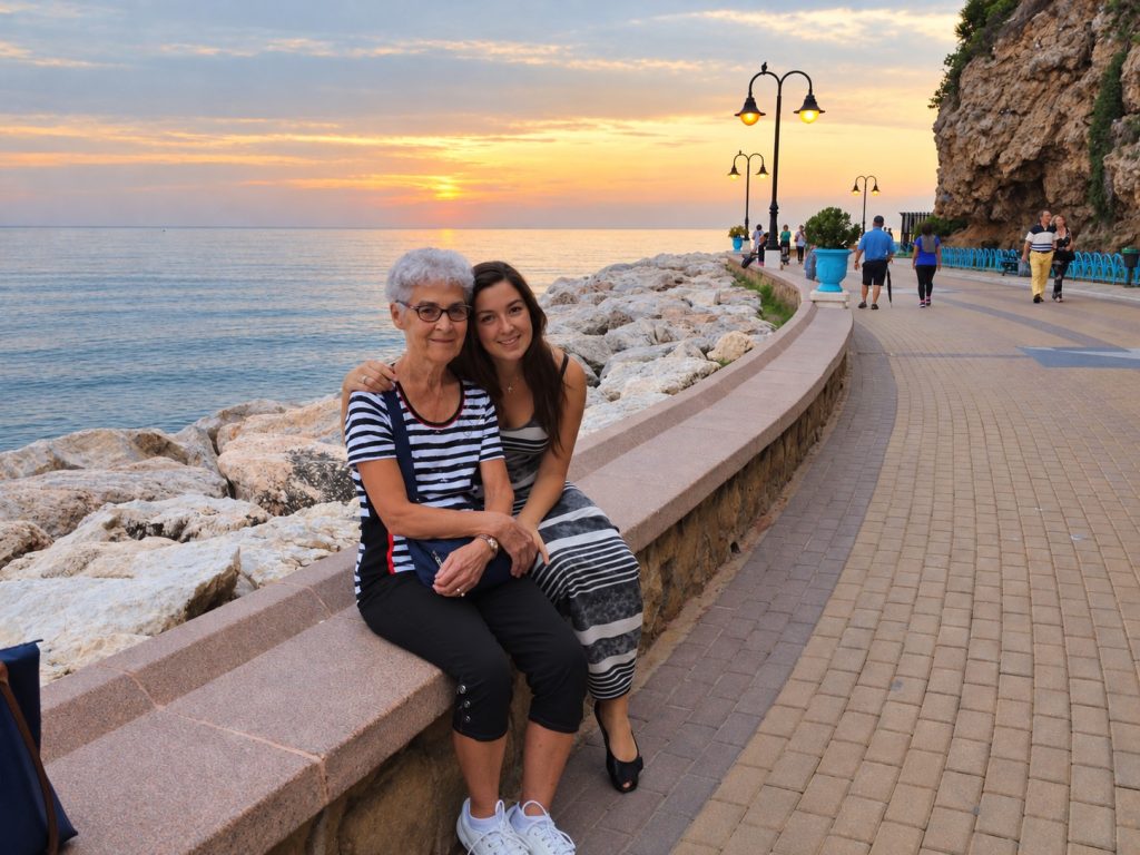Walking along the Costa del Sol seaside promenade in Spain with my grandmother at sunset