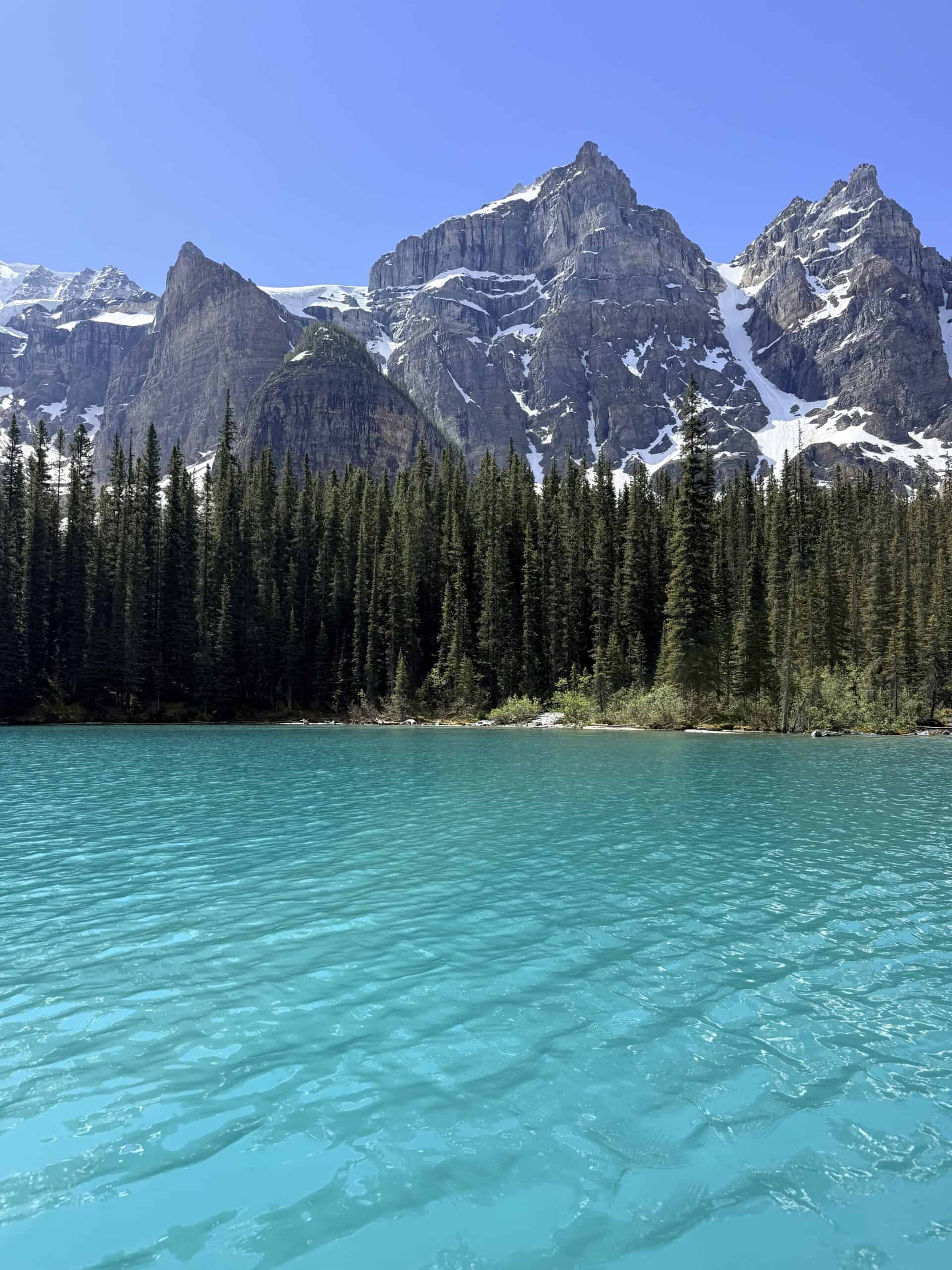 Turquoise water and snow-covered mountain peaks at Moraine Lake in Banff National Park