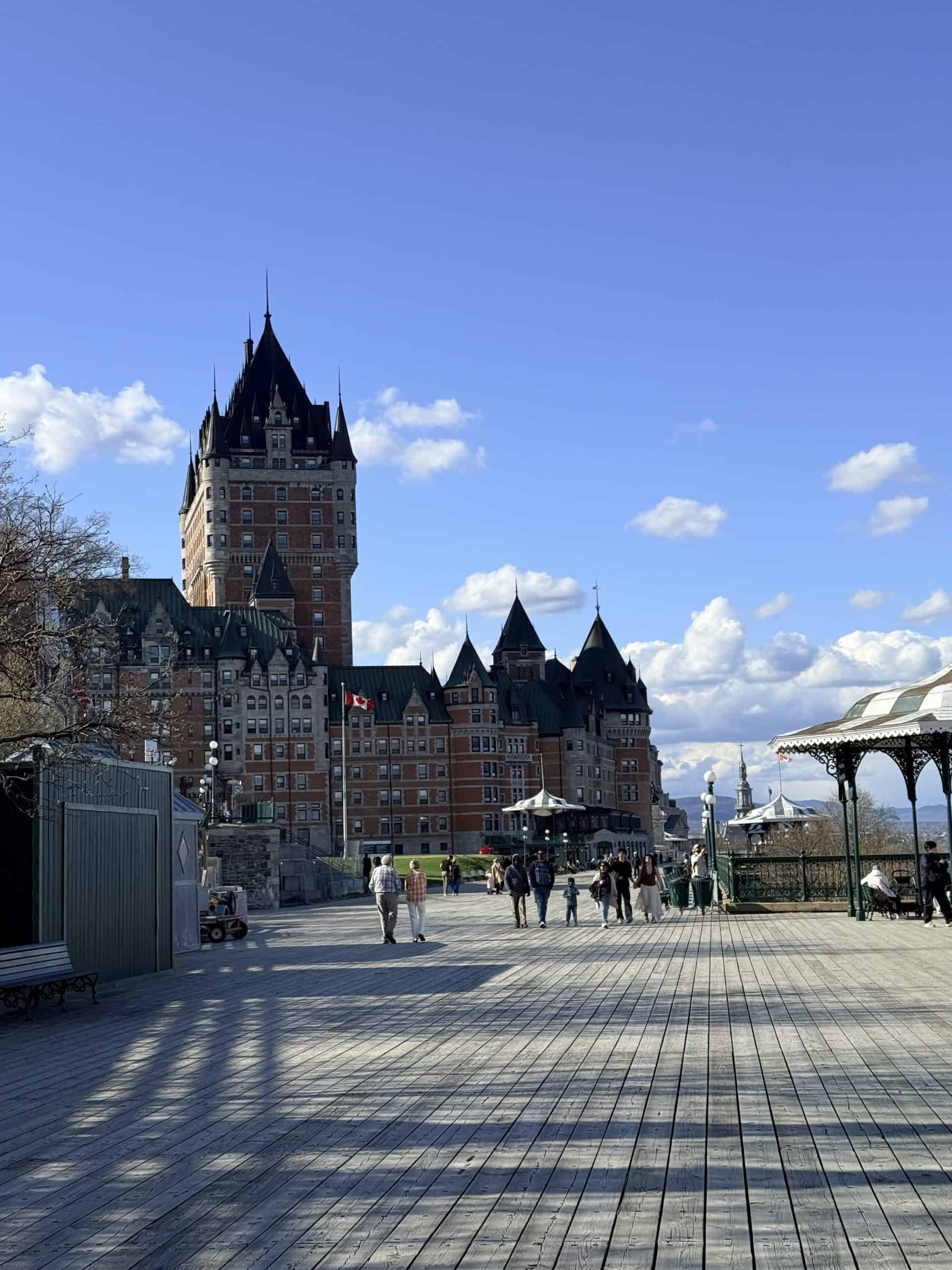 Château Frontenac overlooking Dufferin Terrace in Quebec City on a clear sunny day.
