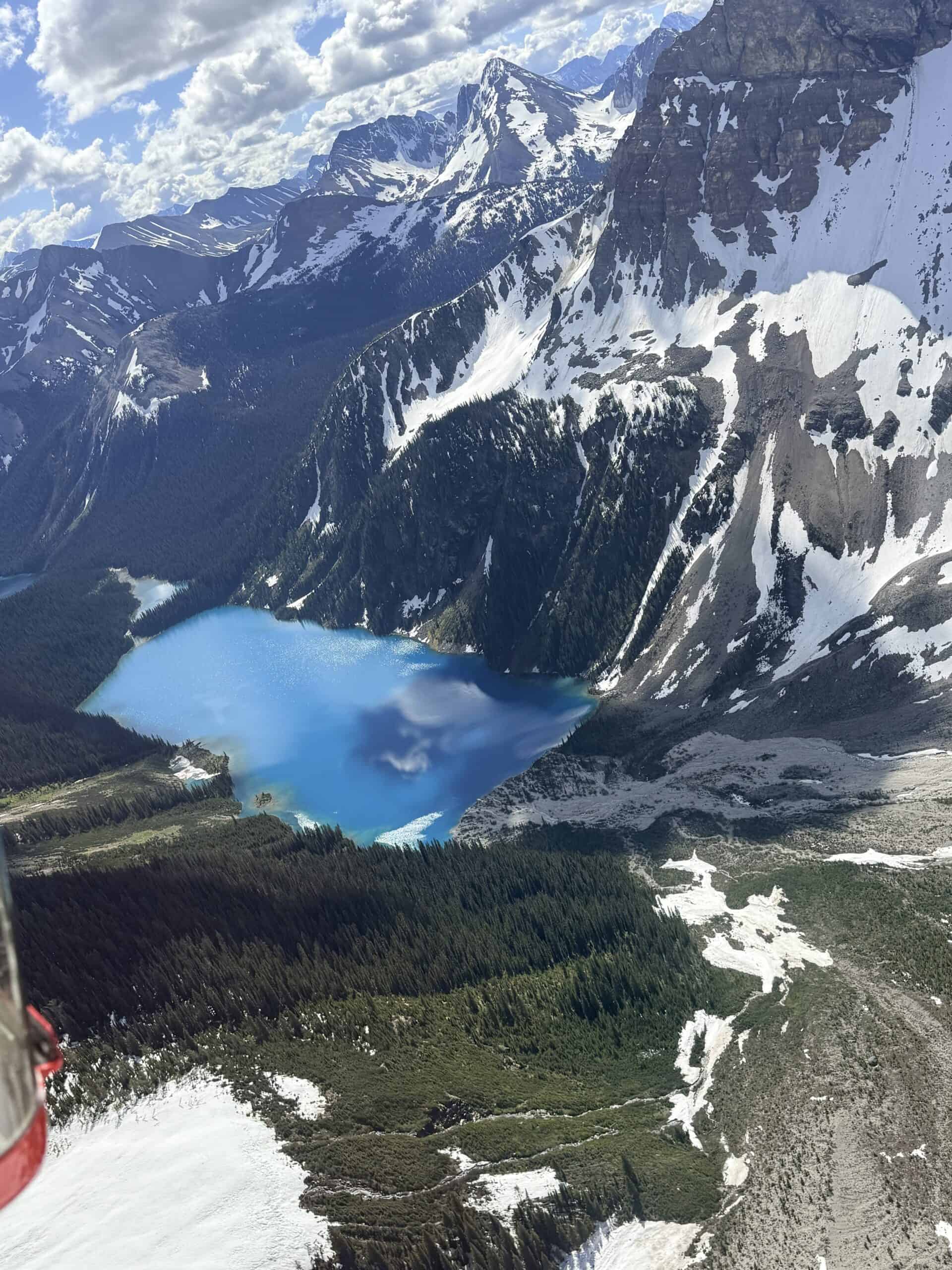 Turquoise alpine lake surrounded by mountains near Canmore in the Canadian Rockies