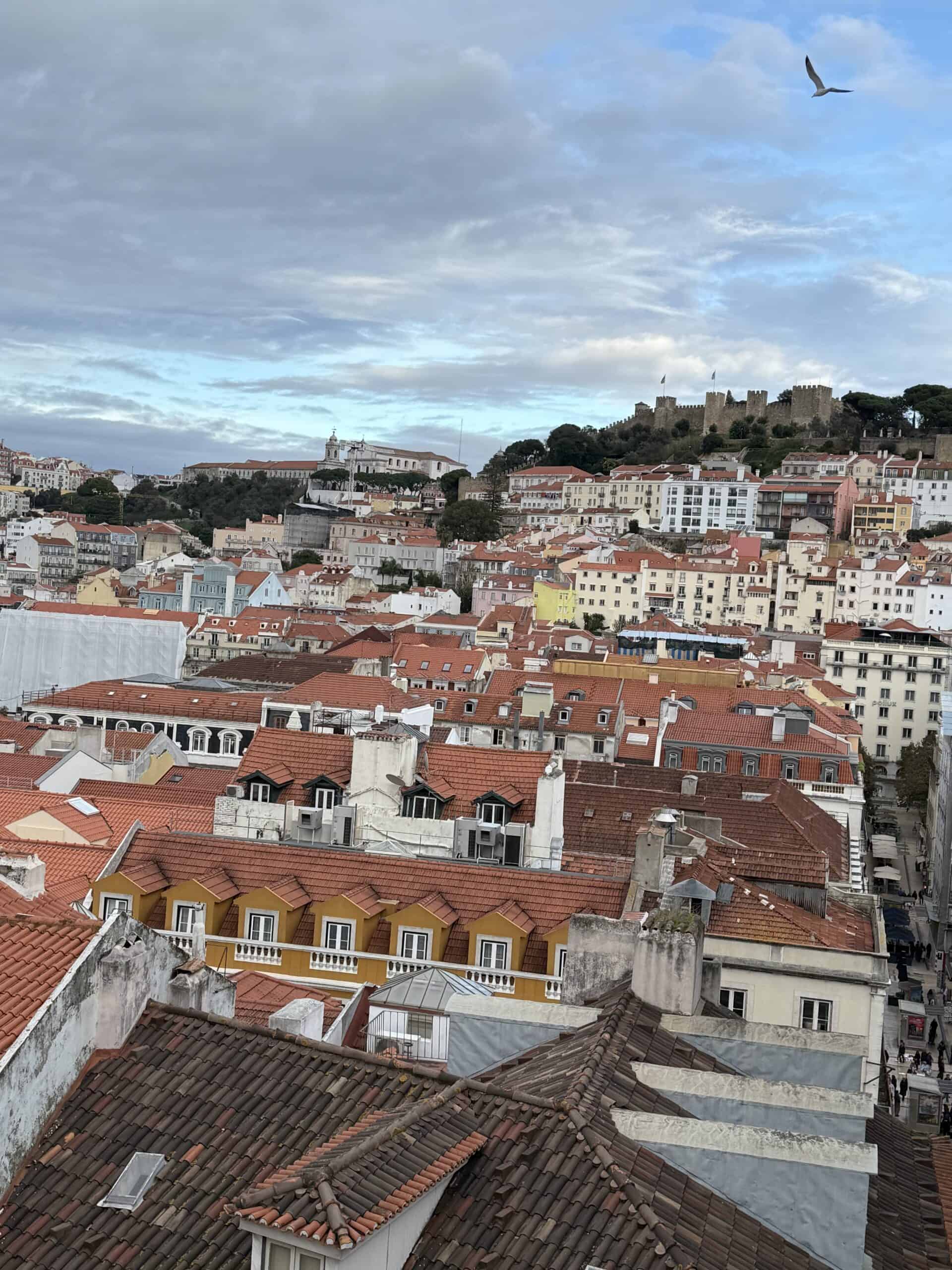 São Jorge Castle overlooking Lisbon's red rooftops and colourful historic buildings.