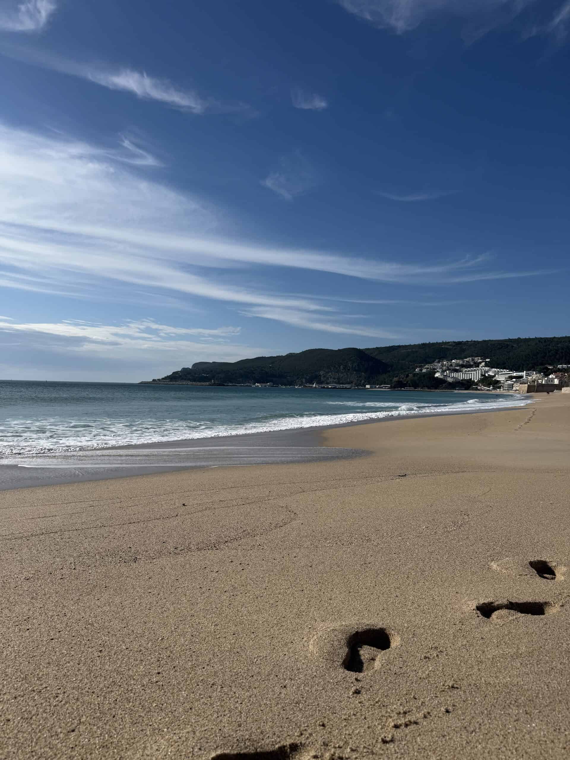 Sandy beach and calm Atlantic coastline in Sesimbra, Portugal