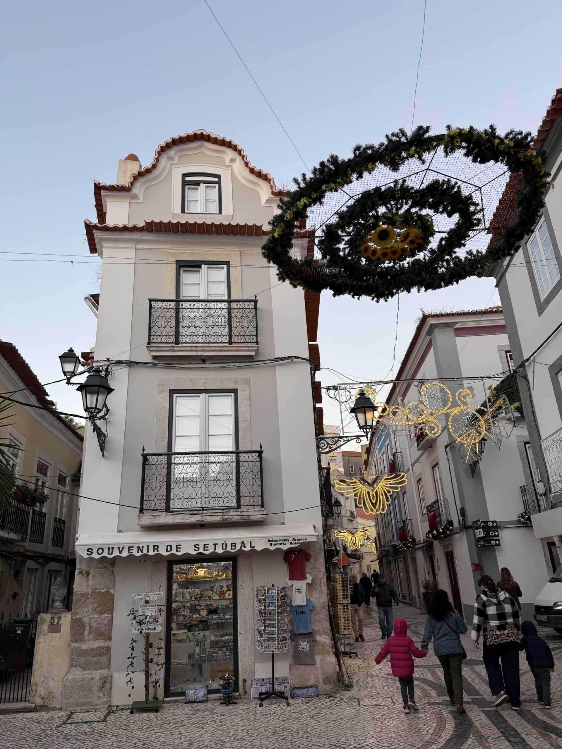 Traditional Portuguese building with wrought-iron balconies and Christmas decorations in Setúbal's historic centre