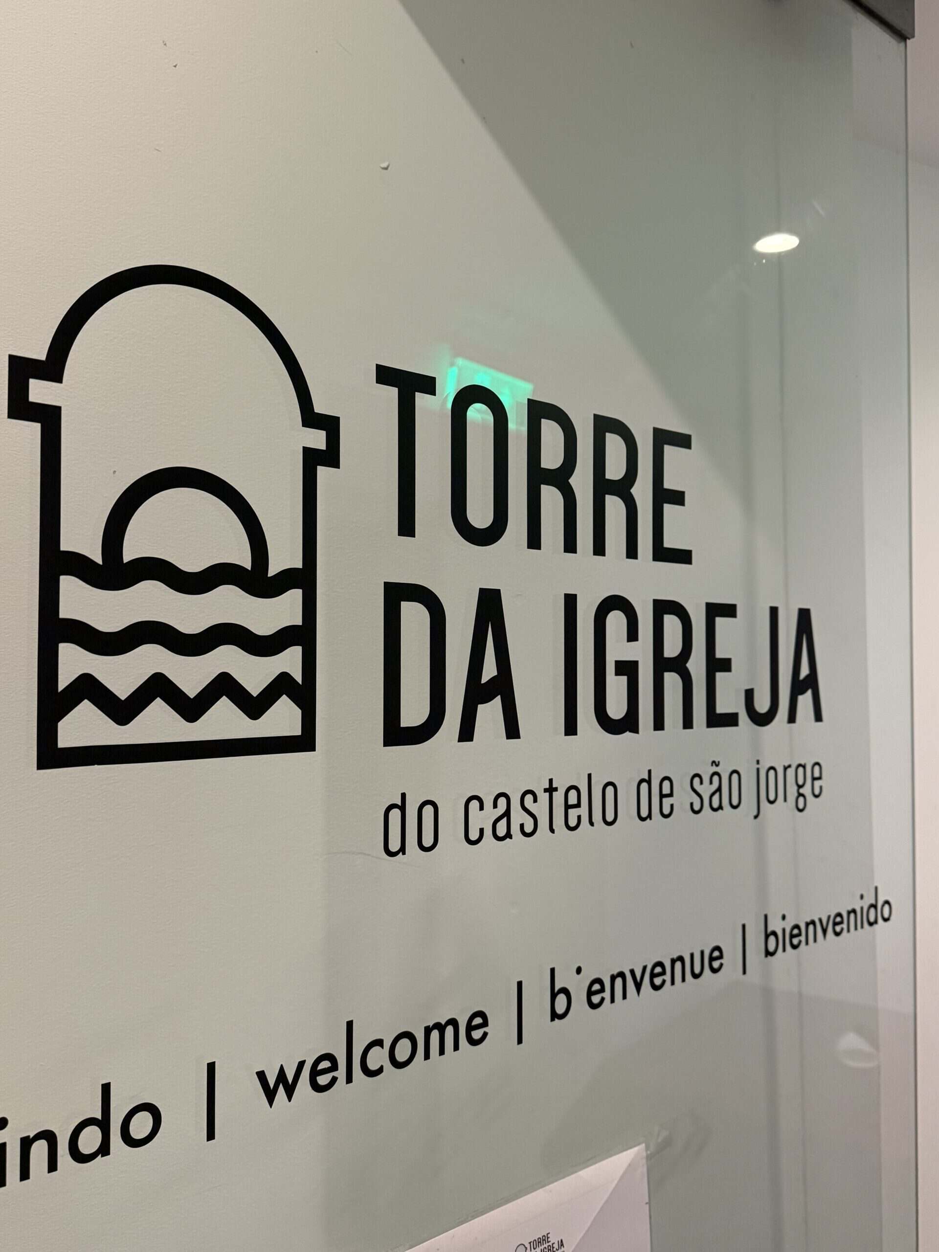 Entrance sign for Torre da Igreja do Castelo de São Jorge, a historic church tower viewpoint beside Lisbon's castle.